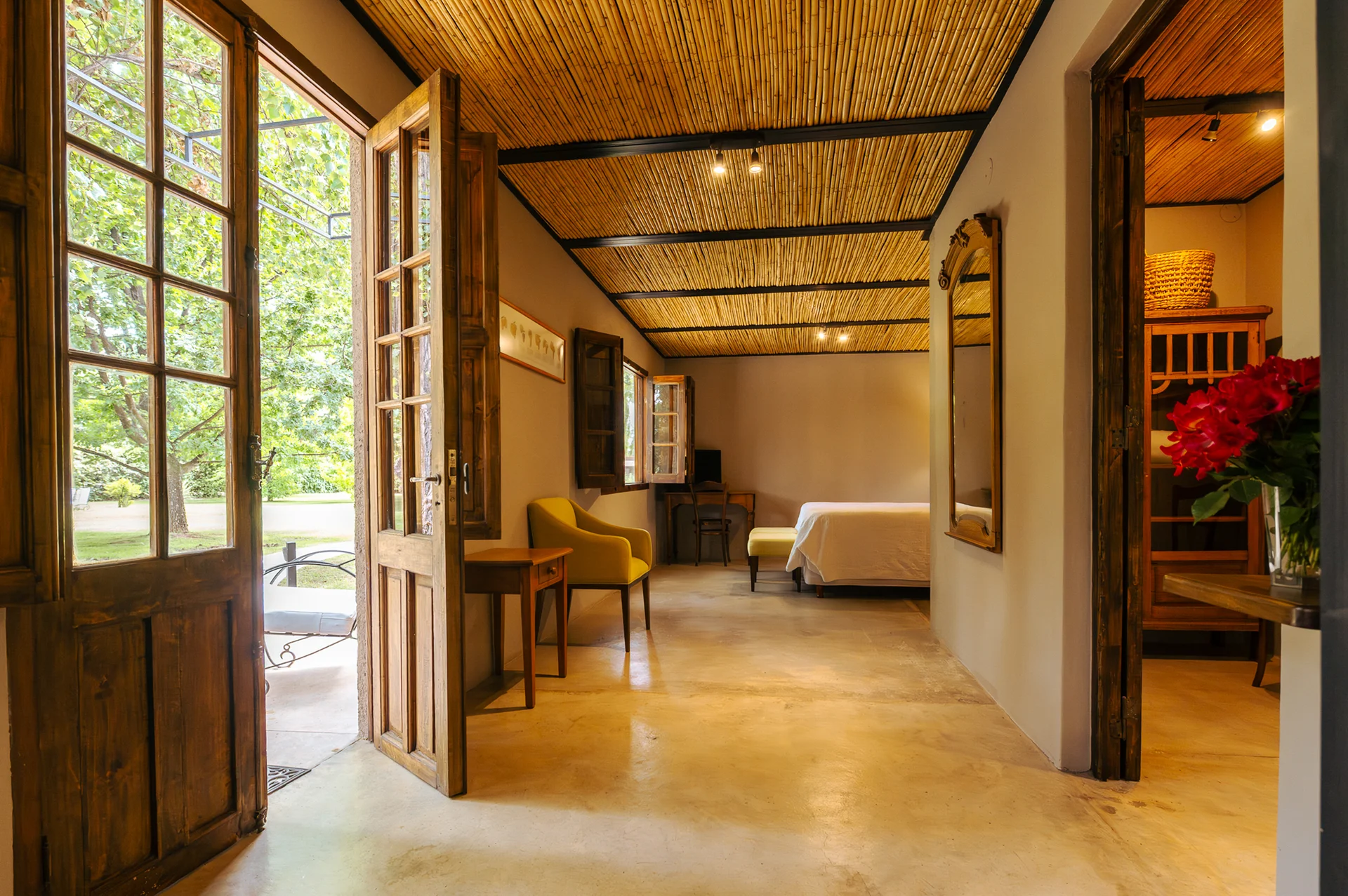 The interior of the Cava Experience, with its reed ceiling and doors onto the garden